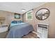 Cozy bedroom with a serene decor and wood-paneled walls at 135 Marina Ct, Canton, GA 30114