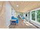 Open-concept living area with wood ceiling and large windows overlooking a wooded view at 135 Marina Ct, Canton, GA 30114