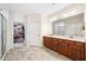 A spacious bathroom with double vanity, and a walk-in closet at 306 Cherokee Station Cir, Woodstock, GA 30188