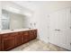 A spacious bathroom with double vanity and a large mirror at 306 Cherokee Station Cir, Woodstock, GA 30188
