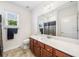 Bright bathroom featuring a white vanity countertop and a decorative framed mirror at 306 Cherokee Station Cir, Woodstock, GA 30188