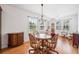 Dining room featuring hardwood floors and lots of natural light from many windows at 306 Cherokee Station Cir, Woodstock, GA 30188
