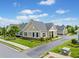 A well-maintained home with lush green landscaping, a private driveway, and a welcoming front porch and entryway at 306 Cherokee Station Cir, Woodstock, GA 30188