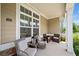 Charming, covered front porch with seating, offering a cozy outdoor space to relax and enjoy the neighborhood at 306 Cherokee Station Cir, Woodstock, GA 30188