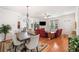 Spacious living room with fireplace, dining area, hardwood floors, and an open concept design at 306 Cherokee Station Cir, Woodstock, GA 30188
