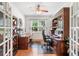 Dedicated home office featuring dual workstations, hardwood floors, and bright natural light at 306 Cherokee Station Cir, Woodstock, GA 30188
