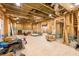 Unfinished basement with exposed beams, concrete floor and framing throughout at 3180 Lee Dr, Buford, GA 30518