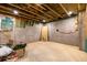 Unfinished basement with exposed beams, concrete floor and framing throughout at 3180 Lee Dr, Buford, GA 30518