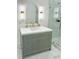 Elegant bathroom vanity featuring modern lighting and a glass-enclosed shower at 3180 Lee Dr, Buford, GA 30518