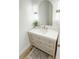 Bathroom with modern vanity, gold accents, and stylish lighting at 3180 Lee Dr, Buford, GA 30518