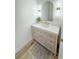 Elegant powder room with custom vanity, quartz countertop, and decorative lighting at 3180 Lee Dr, Buford, GA 30518