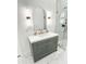 Bathroom featuring white marble floors and walls, a modern vanity and mirror, and a glass-enclosed shower at 3180 Lee Dr, Buford, GA 30518