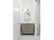 Stylish bathroom with a marble vanity, unique lighting, and modern finishes at 3180 Lee Dr, Buford, GA 30518