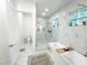 Elegant bathroom boasts a luxurious walk-in shower, freestanding tub, and high end fixtures at 3180 Lee Dr, Buford, GA 30518
