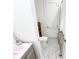 Bathroom featuring a marble tiled floor, toilet, vanity sink and shower at 3180 Lee Dr, Buford, GA 30518