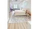Inviting bedroom showcases soft rug, large windows, a work area, and a seating area at 3180 Lee Dr, Buford, GA 30518