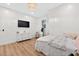 Comfortable bedroom featuring a decorative light fixture, dresser, and large windows at 3180 Lee Dr, Buford, GA 30518