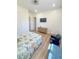 Bright bedroom featuring light-colored wood flooring, a TV, and ample space at 3180 Lee Dr, Buford, GA 30518