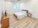 Bright bedroom featuring a queen bed, wood flooring, and a window for natural light at 3180 Lee Dr, Buford, GA 30518