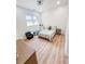Cozy bedroom with light wood floors, window, closet, and ceiling fan at 3180 Lee Dr, Buford, GA 30518