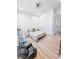 Clean bedroom with light wood floors, window, closet, ceiling fan, and neutral paint at 3180 Lee Dr, Buford, GA 30518