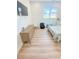 Spacious bedroom featuring light-colored wood flooring, a TV, and ample space at 3180 Lee Dr, Buford, GA 30518