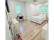 Bright bedroom with light wood flooring, vanity, and natural light at 3180 Lee Dr, Buford, GA 30518