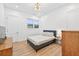 Cozy bedroom featuring ample light, hardwood floors, and a comfortable bed at 3180 Lee Dr, Buford, GA 30518