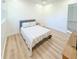 Cozy bedroom with a comfy queen bed, light wood floors, and view of the landing at 3180 Lee Dr, Buford, GA 30518