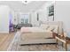 Bright bedroom with a plush rug, and curtains, with a sofa in the background at 3180 Lee Dr, Buford, GA 30518