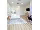 Large bedroom featuring hardwood floors, a seating area, and a vanity at 3180 Lee Dr, Buford, GA 30518