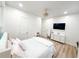 Bright bedroom featuring wood floors, a white-framed bed, a mirrored dresser, and a modern ceiling fan at 3180 Lee Dr, Buford, GA 30518