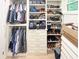 Walk-in closet with custom shelving, drawers, and ample space for storage at 3180 Lee Dr, Buford, GA 30518
