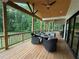 Spacious covered deck perfect for entertaining and enjoying outdoor living at 3180 Lee Dr, Buford, GA 30518