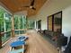 Covered porch provides the perfect space to watch play in your own backyard at 3180 Lee Dr, Buford, GA 30518