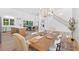 Open-concept dining area with modern decor, seamlessly connected to the kitchen and living spaces at 3180 Lee Dr, Buford, GA 30518