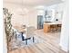 Open-concept dining area with modern chandelier adjacent to the island kitchen at 3180 Lee Dr, Buford, GA 30518