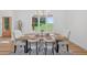 Bright dining room featuring a modern light fixture and a large window with scenic outdoor views at 3180 Lee Dr, Buford, GA 30518