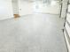 Large garage with newly epoxied floor, electric door, and a side door at 3180 Lee Dr, Buford, GA 30518