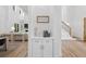 Hallway nook with custom cabinetry and stairs leading to the second floor at 3180 Lee Dr, Buford, GA 30518