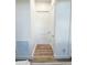Hallway features a clean look, wood floors, and access to storage and other rooms at 3180 Lee Dr, Buford, GA 30518