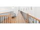 Second story hallway with lots of light and chair at 3180 Lee Dr, Buford, GA 30518