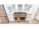 Gourmet kitchen with stainless steel dual oven, white cabinets, and marble backsplash at 3180 Lee Dr, Buford, GA 30518