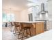 Modern kitchen with stainless steel appliances, large island, and eat in dining area at 3180 Lee Dr, Buford, GA 30518