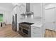 Bright and open concept living area, featuring a modern kitchen and living space at 3180 Lee Dr, Buford, GA 30518