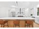Bright kitchen with large island, stainless steel appliances, white cabinets, and modern finishes at 3180 Lee Dr, Buford, GA 30518