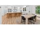 Open kitchen design with an island, stainless steel appliances, breakfast bar and adjacent dining area perfect for entertaining at 3180 Lee Dr, Buford, GA 30518