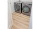 Modern laundry room equipped with front-loading washer and dryer at 3180 Lee Dr, Buford, GA 30518