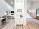 Living room featuring high ceilings, open floorplan, hardwood floors, and cozy fireplace at 3180 Lee Dr, Buford, GA 30518