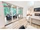 Bright living room boasts a fireplace and flows to the deck for seamless indoor-outdoor living at 3180 Lee Dr, Buford, GA 30518